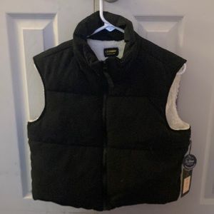 Black vest with tags on